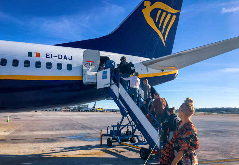 Malaga/spain,,Dec.,23,,2019.,Group,Of,People,Entering,A,Ryanair