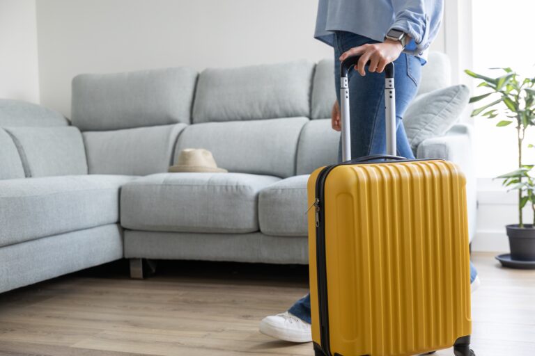 Young,Woman,Goes,On,Vacation,With,Her,Yellow,Suitcase.,She