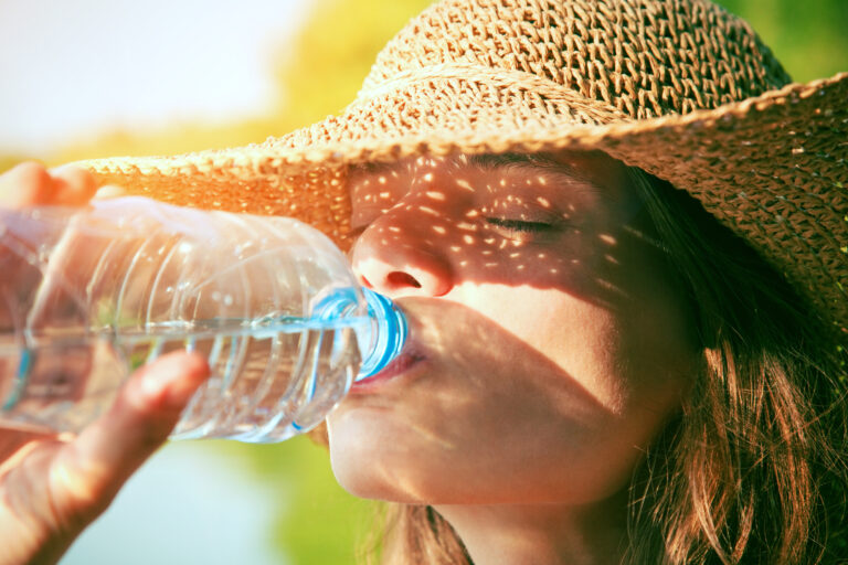 Woman,Drinking,Water,In,Summer,Sunlight