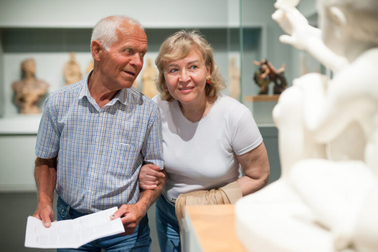 Male,And,Female,Pensioners,Visiting,Exposition,Of,Museum,And,Reading