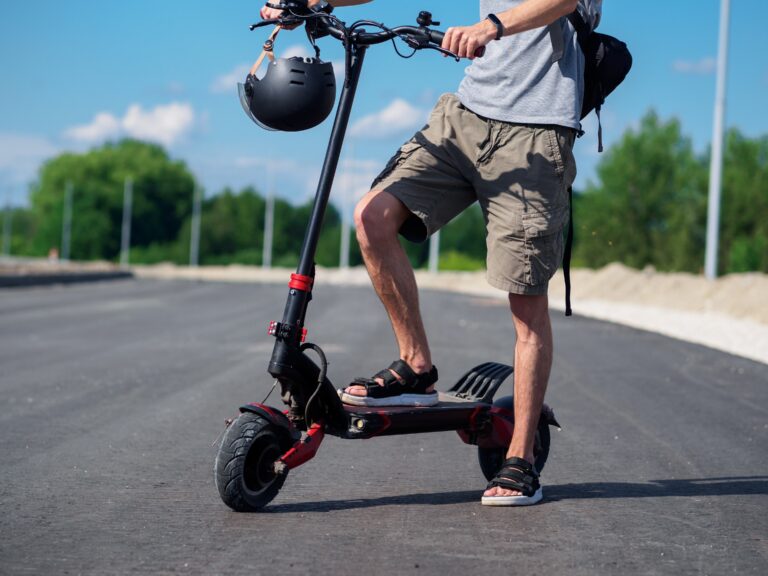 Powerful,Urban,Electric,Scooter,On,The,Road.,Rider,With,A