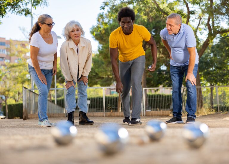 Mature,Casual,Diverse,Pensioners,Throwing,Petanque,Balls,On,The,Sand