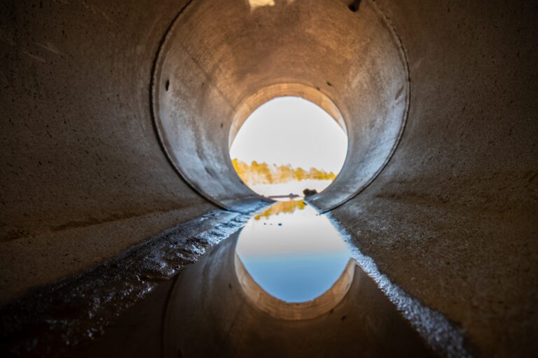 Inside,A,Circular,Concrete,Drainage,Culvert,With,A,Trickle,Of