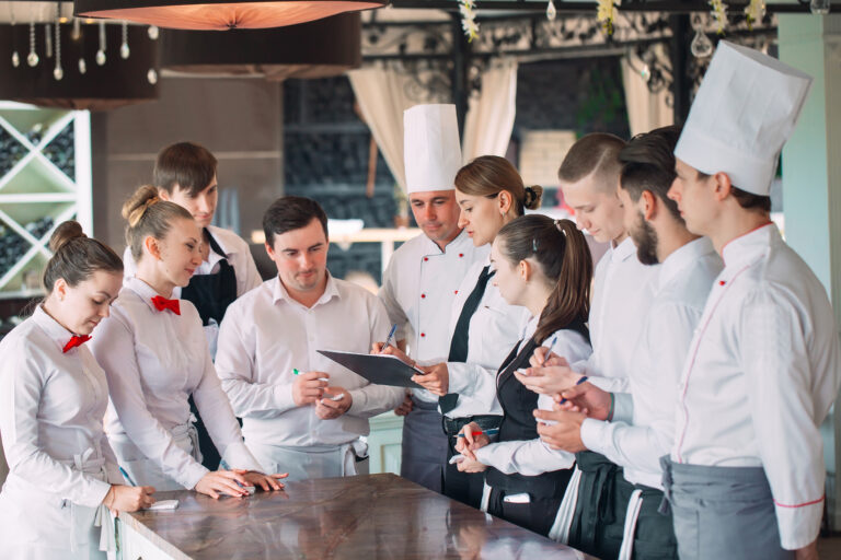 Restaurant,Manager,And,His,Staff,In,Terrace.,Interacting,To,Head