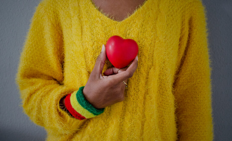 Hand,Of,A,Black,Woman,With,A,Red,,Yellow,And