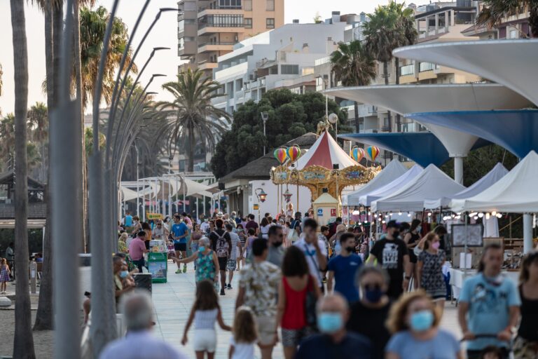 Estepona,,Spain,-,August,3,2021:,People,Walking,The,Beach