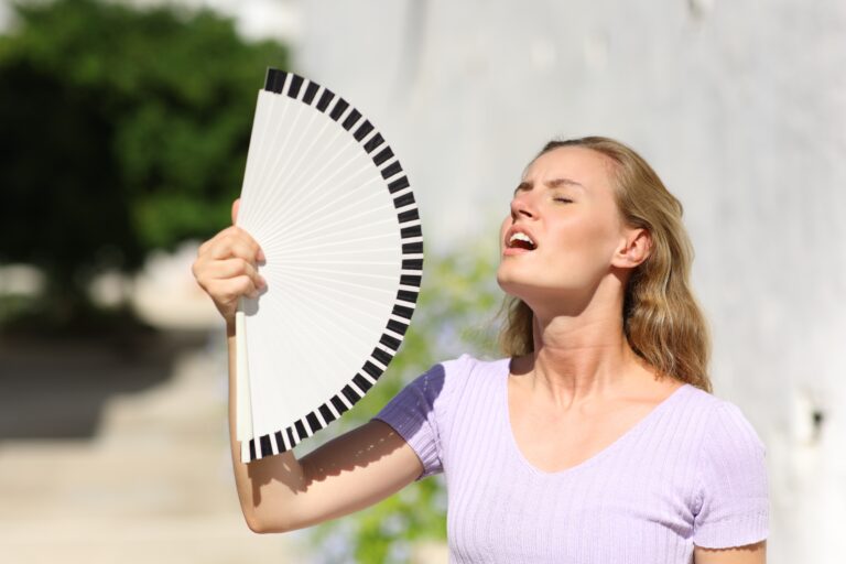 Stressed,Woman,Suffering,Heatstroke,On,Summer,In,A,Town