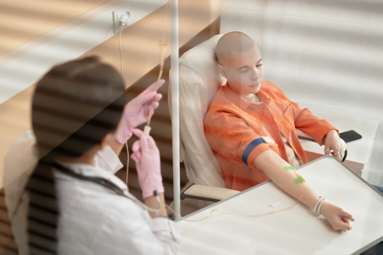 High,Angle,Portrait,Of,Bald,Young,Woman,Receiving,Chemotherapy,Treatment