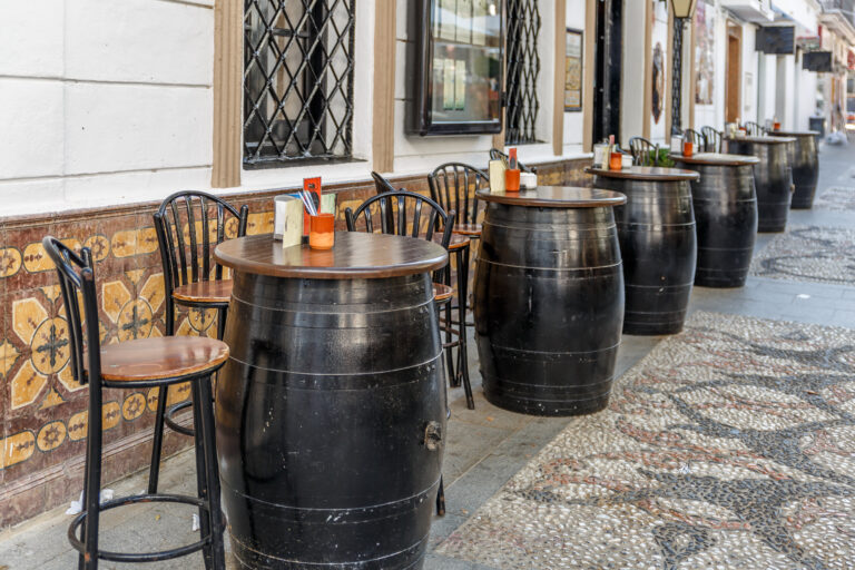 Typical,Spanish,Bar,With,Oak,Barrels,On,The,Outside,,To