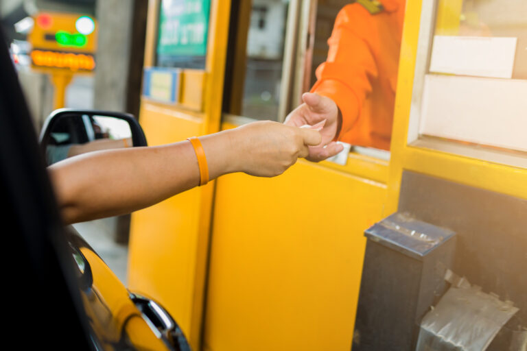 Driver,Pay,For,The,Expressway,With,Selective,Focus.