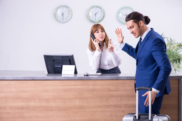 Young,Businessman,At,Hotel,Reception