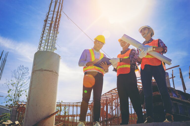 Structural,Engineer,Or,Architect,And,Foreman,Worker,With,Blueprints,Discuss,