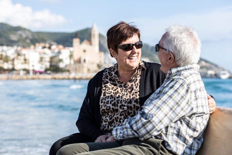 Two,Seniors,Sitting,On,A,Sitges,Bench,,In,Spain