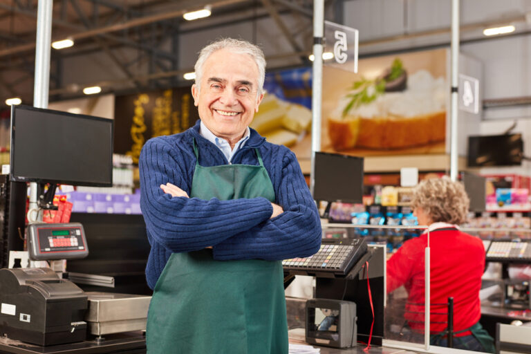 Smiling,Senior,As,A,Market,Manager,With,Crossed,Arms,In