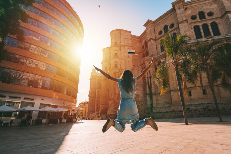 Happy,Carefree,Woman,Jumping,And,Enjoying,Life,On,Summer,Vacation