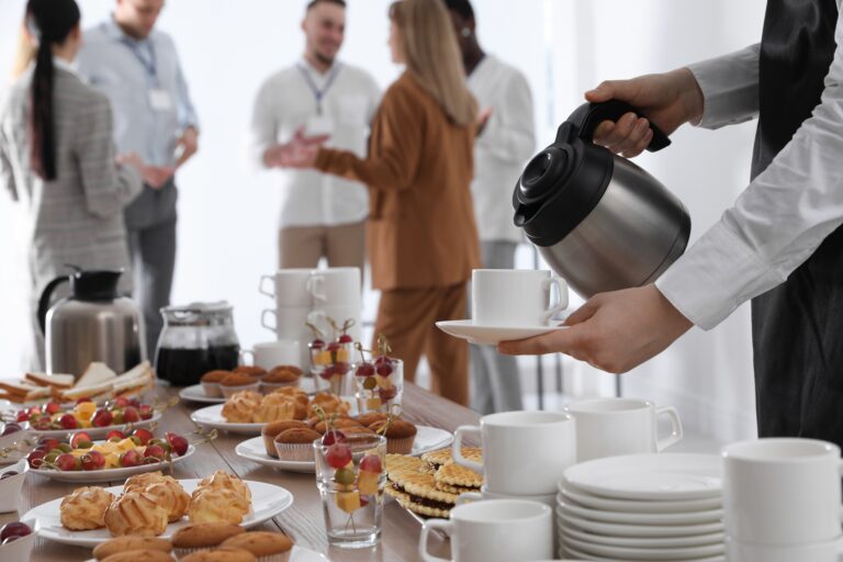 Waitress,Pouring,Hot,Drink,During,Coffee,Break,,Closeup