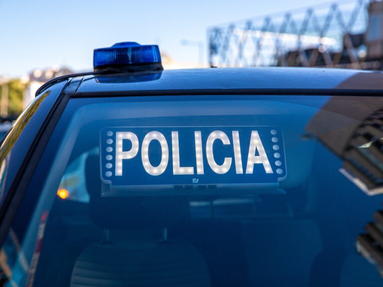 Blue,Lights,On,The,Roof,Of,A,Police,Car,With