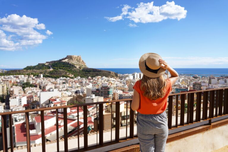 Traveler,Girl,Enjoying,View,Of,Alicante,Cityscape,And,Mount,Benacantil