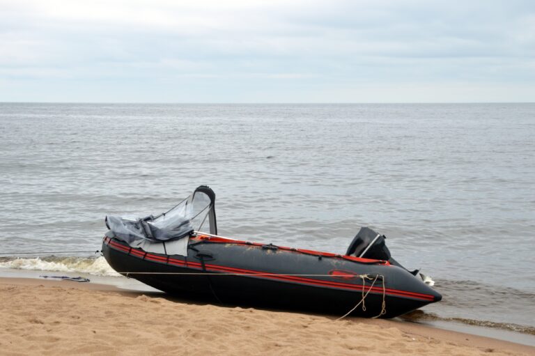 Rubber,Boat,On,Lake,Shore,By,Summer,Day.