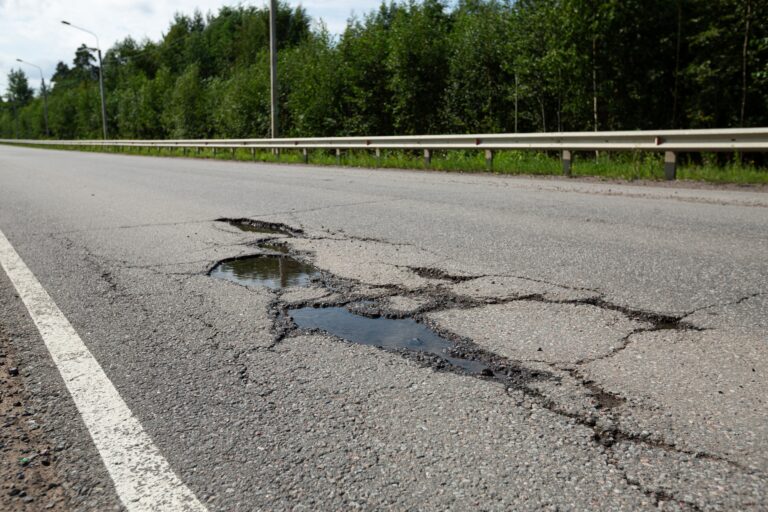 Potholes,On,Bad,Asphalt,Road.,Closeup.,Nobody