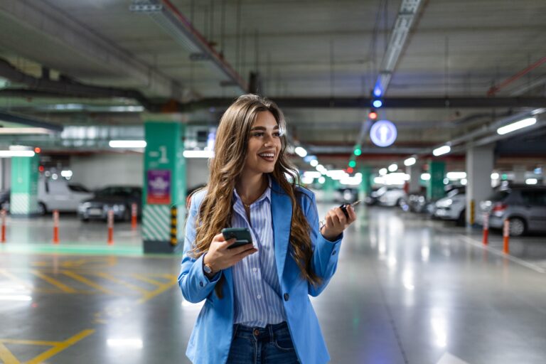 A,Woman,Stands,In,A,Parking,Lot,,Scanning,The,Rows