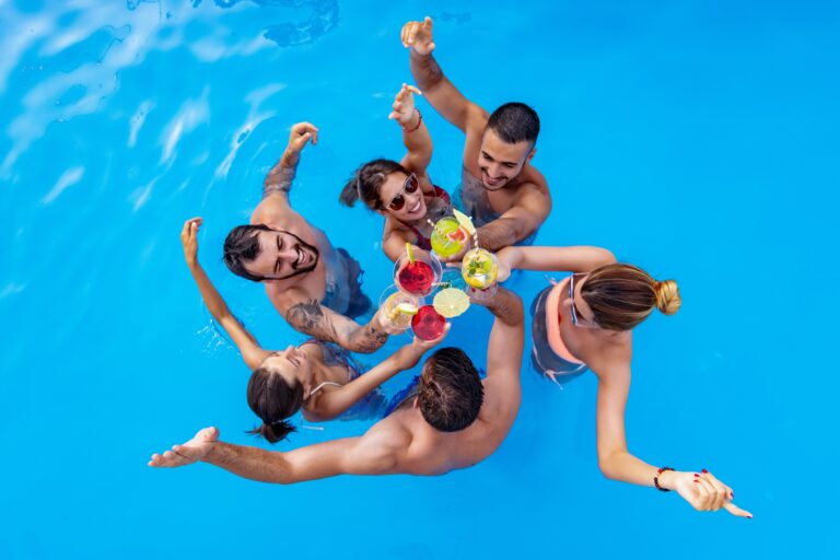 Group,Of,Friends,Having,Party,In,Pool,,Drinking,Cocktail,And