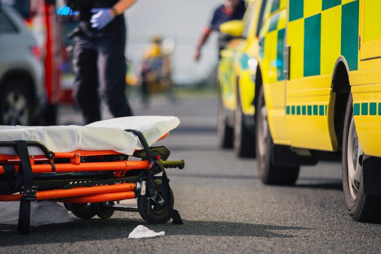 Selective,Focus,On,Stretcher,Against,Ambulance,Cars,Of,Emergency,Medical