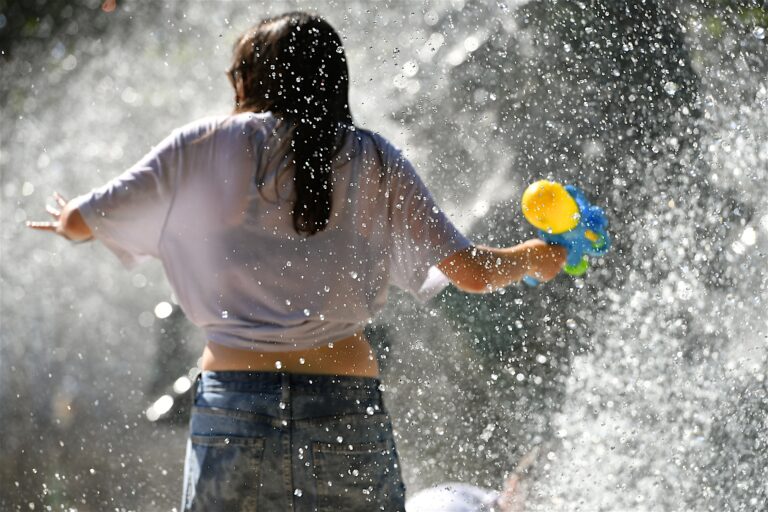 Paris,,France-june,18,2025:young,Girl,With,A,Water,Gun,Plays