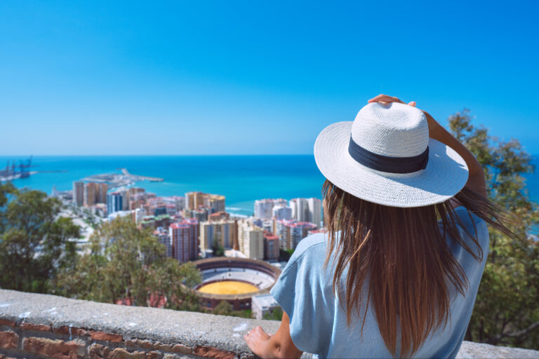 Rear,View,Of,Young,Woman,Traveler,In,White,Sun,Hat