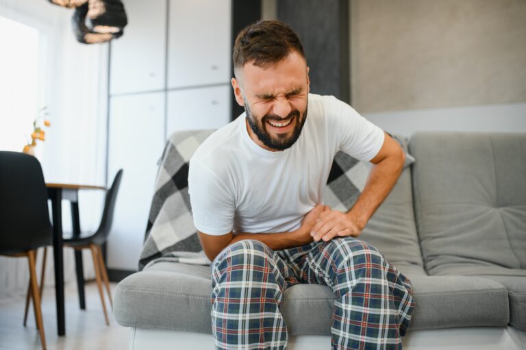 Man,Suffering,From,Stomach,Ache,At,Home.,Food,Poisoning.