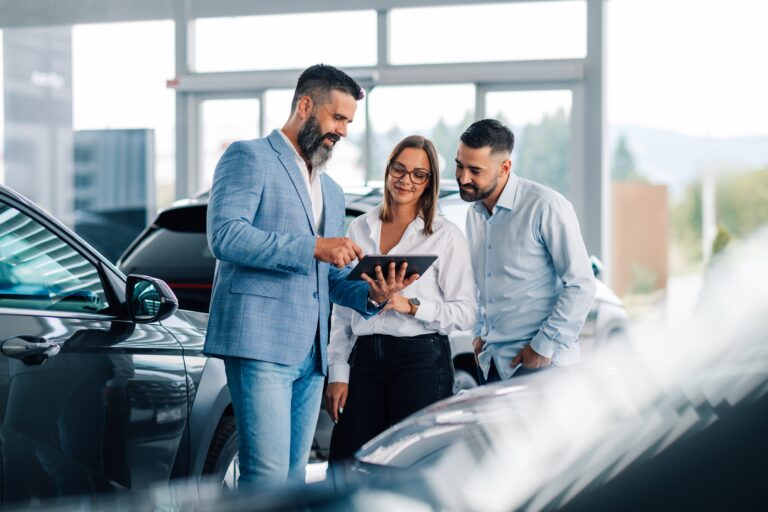 Three,People,Demonstrate,Interactive,Teamwork,With,A,Tablet,In,A