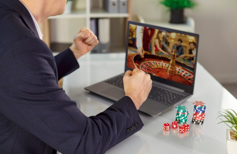 Man,Sitting,At,The,Desk,And,Playing,Gambling,Betting,On