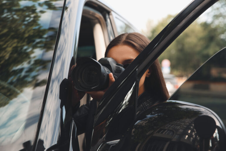 Private,Detective,With,Camera,Spying,Near,Car,Outdoors