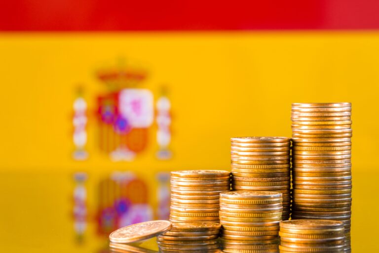 A,Stack,Of,Gold,Coins,On,The,Background,Of,The