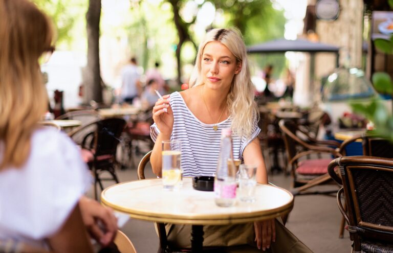 Friends,Talking,And,Drinking,Coffee,Terrace,In,The,City.,Blond