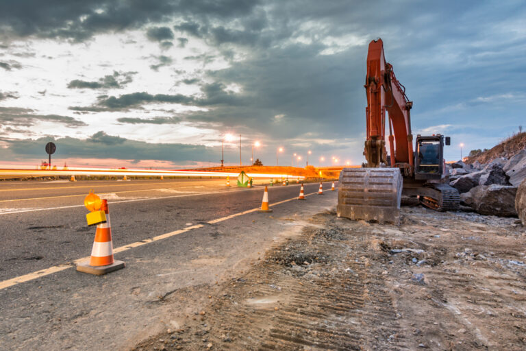 Works,Of,Extension,Of,A,Road,With,Excavator,And,Delimited