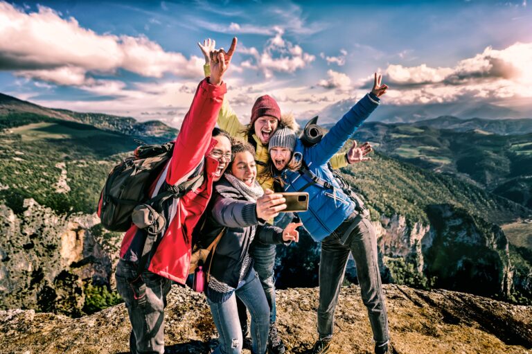 Happy,Friends,Hikers,With,Backpacks,Taking,Selfie,Portrait,On,The