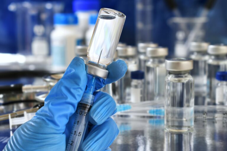 Medical,Personnel,Filling,A,Syringe,Needle,With,Generic,Vaccine,Booster