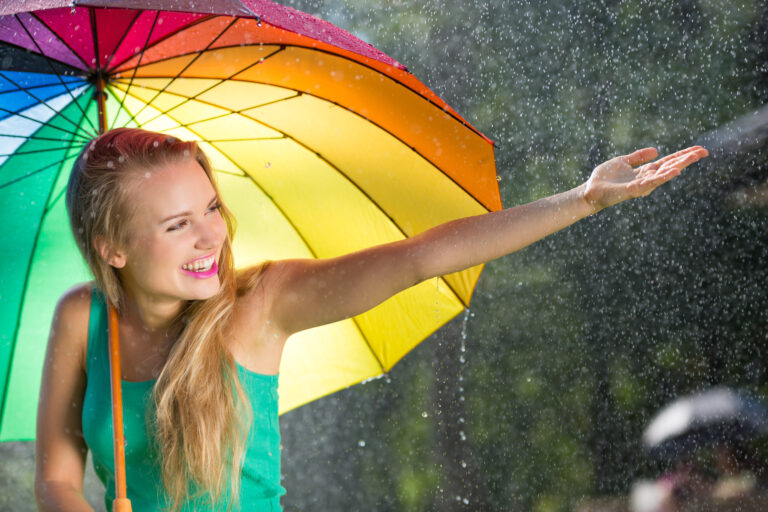 Girl,With,Rainbow,Umbrella,Under,Summer,Rain