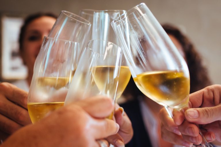 Close,Up,Of,A,Group,Of,Friends,Holding,Glasses,Of