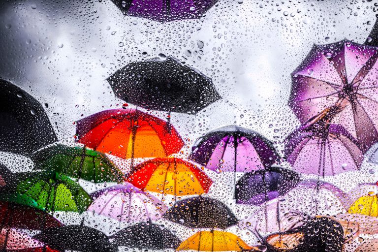 View,Through,Glass,Covered,With,Raindropson,A,City,Square,Hung