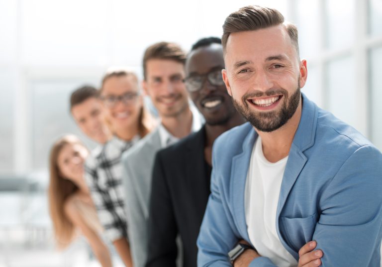 Six,Different,People,Standing,In,A,Row.