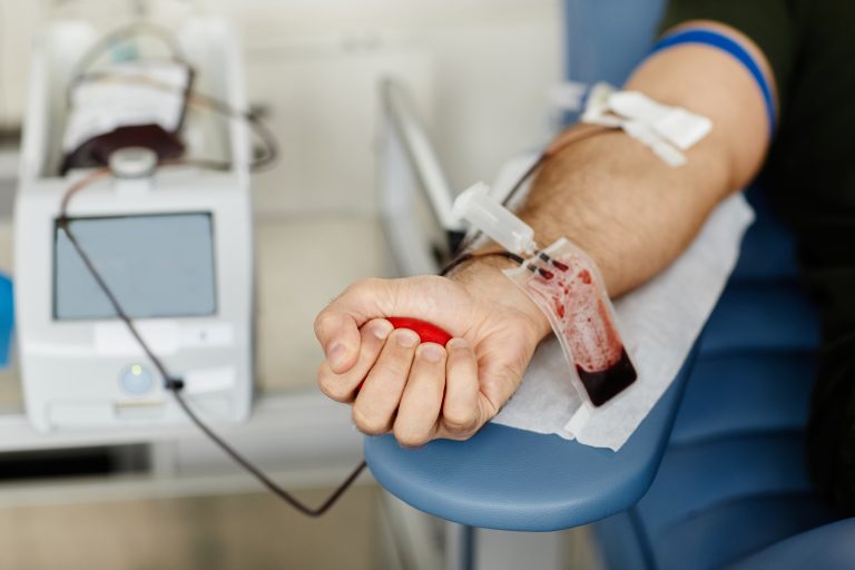 Closeup,Of,Male,Hand,Squeezing,Stress,Ball,While,Giving,Blood
