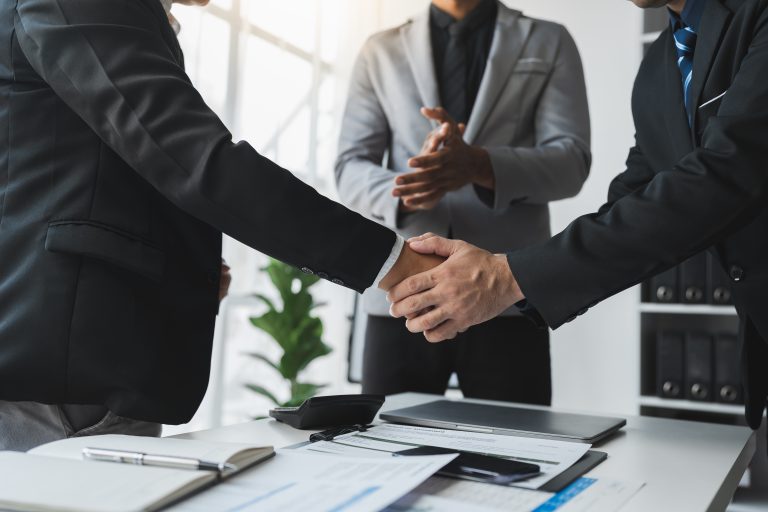 A,Team,Of,Businessmen,,Investors,Stand,To,Congratulate,Their,Teammates