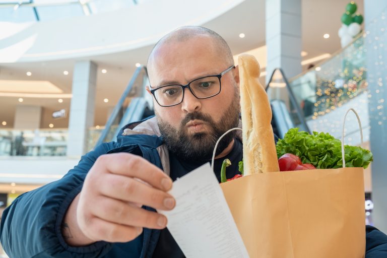 Disappointed,Plus,Size,Man,With,Shopping,Paper,Bag,Full,Of