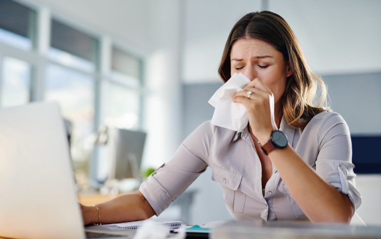 Woman,,Tissue,And,Sick,By,Laptop,In,Office,With,Runny