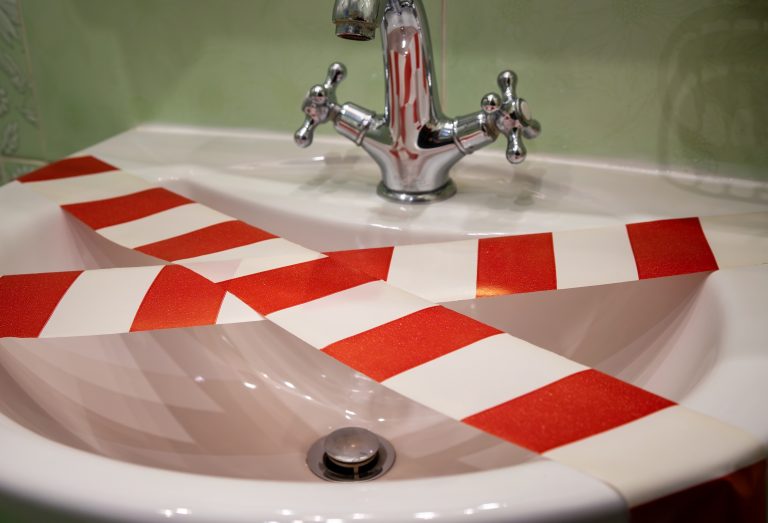 The,Danger,Of,Tap,Water.,The,Red-and-white,Warning,Tape,Is