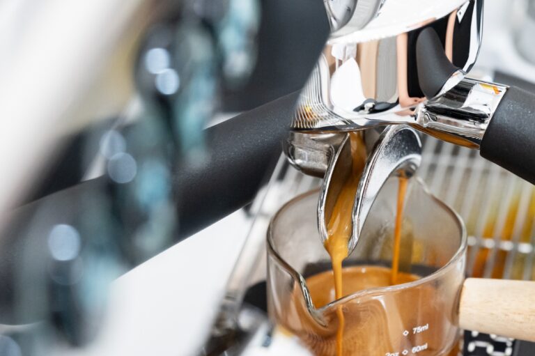 Coffee,Machine,Brewing,Espresso,In,To,Glass,Cup.barista,While,Preparing